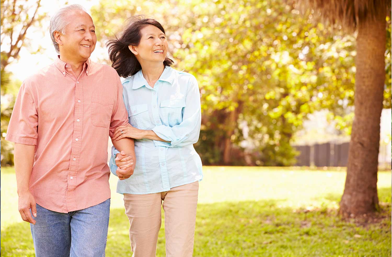 asian couple walking outdoors