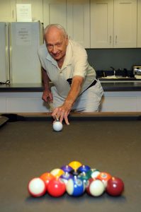 senior man playing pool