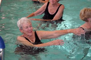 senior woman doing water aerobics