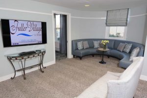 round blue sofa and white chair