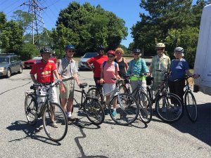 group of adults riding bikes