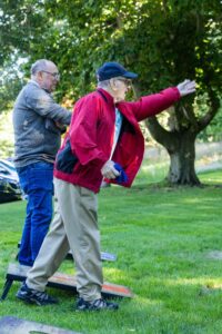 older men playing corn hole