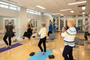 senior women in yoga class