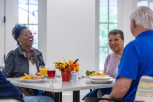 adults enjoying a meal together