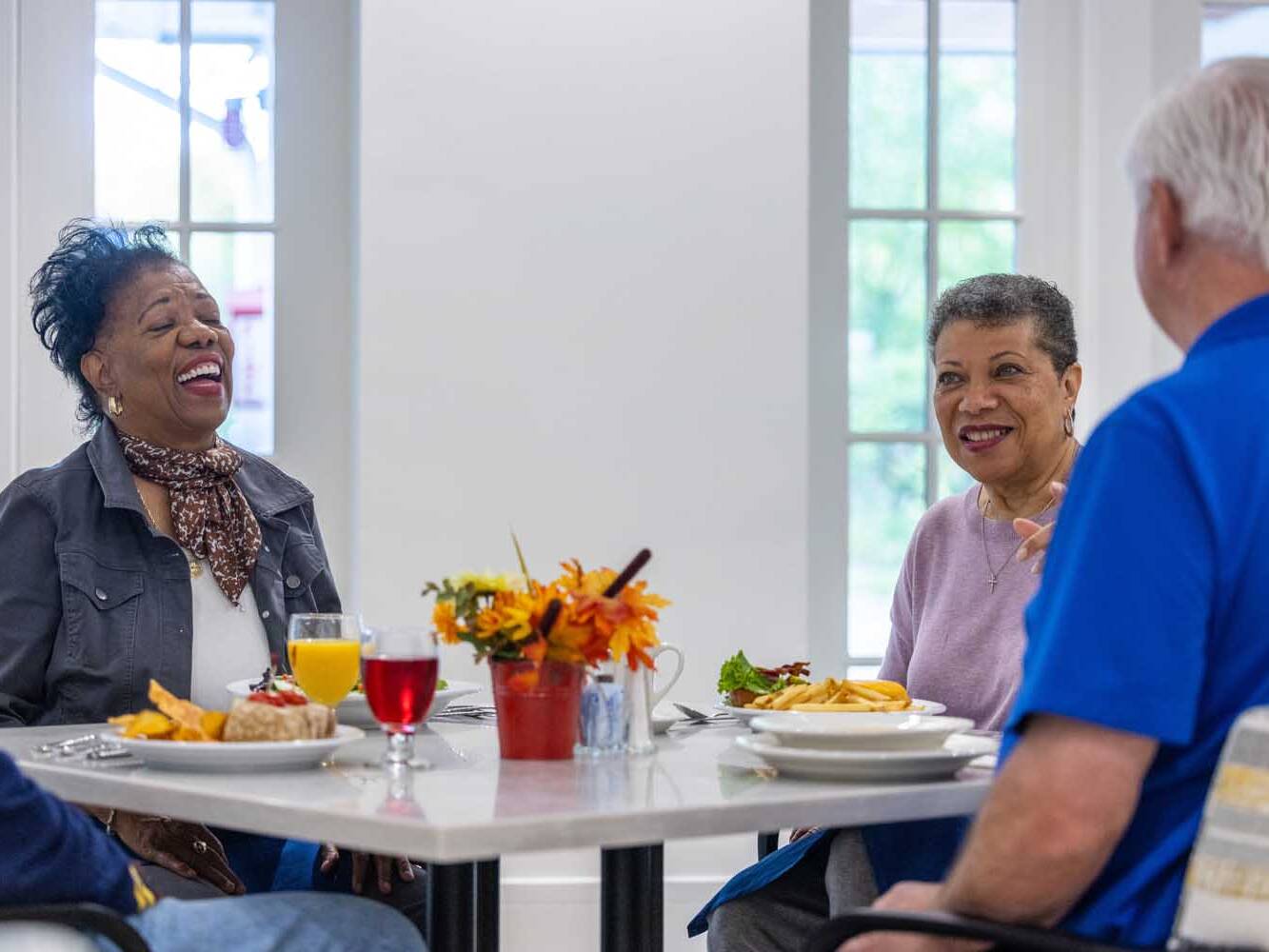 adults enjoying a meal together